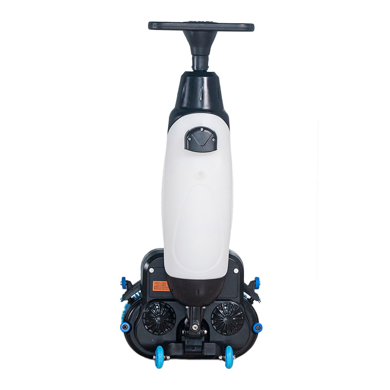 Walk behind floor scrubber cleaning hard floors