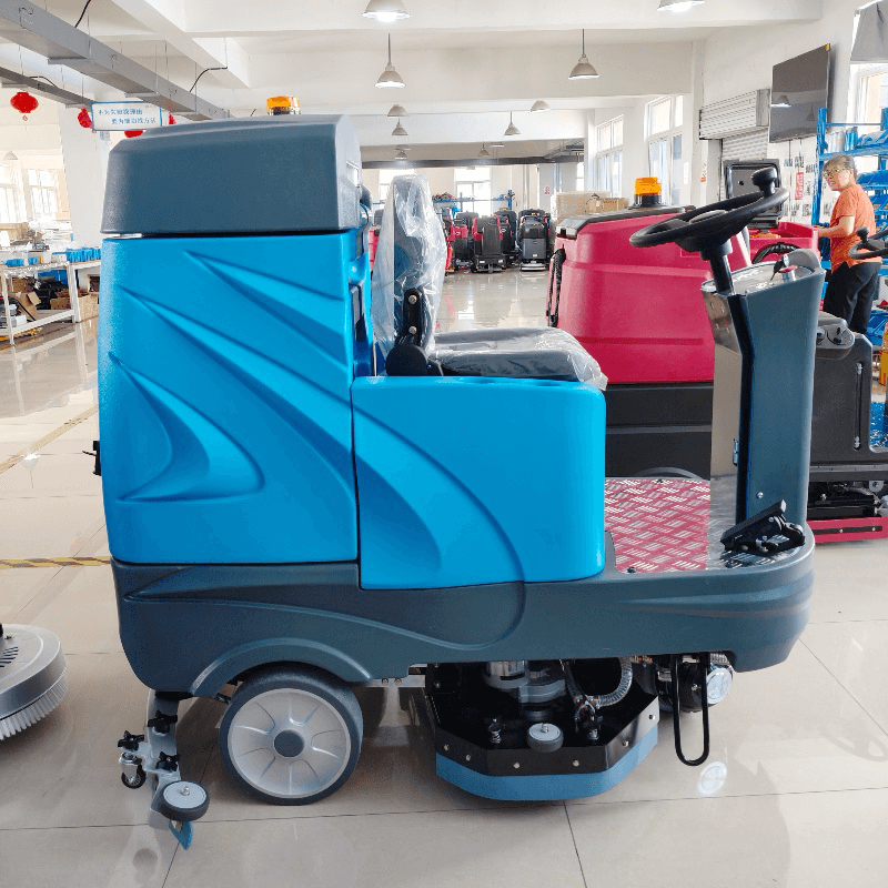 Ride On Floor Scrubber operating efficiently in a large warehouse environment